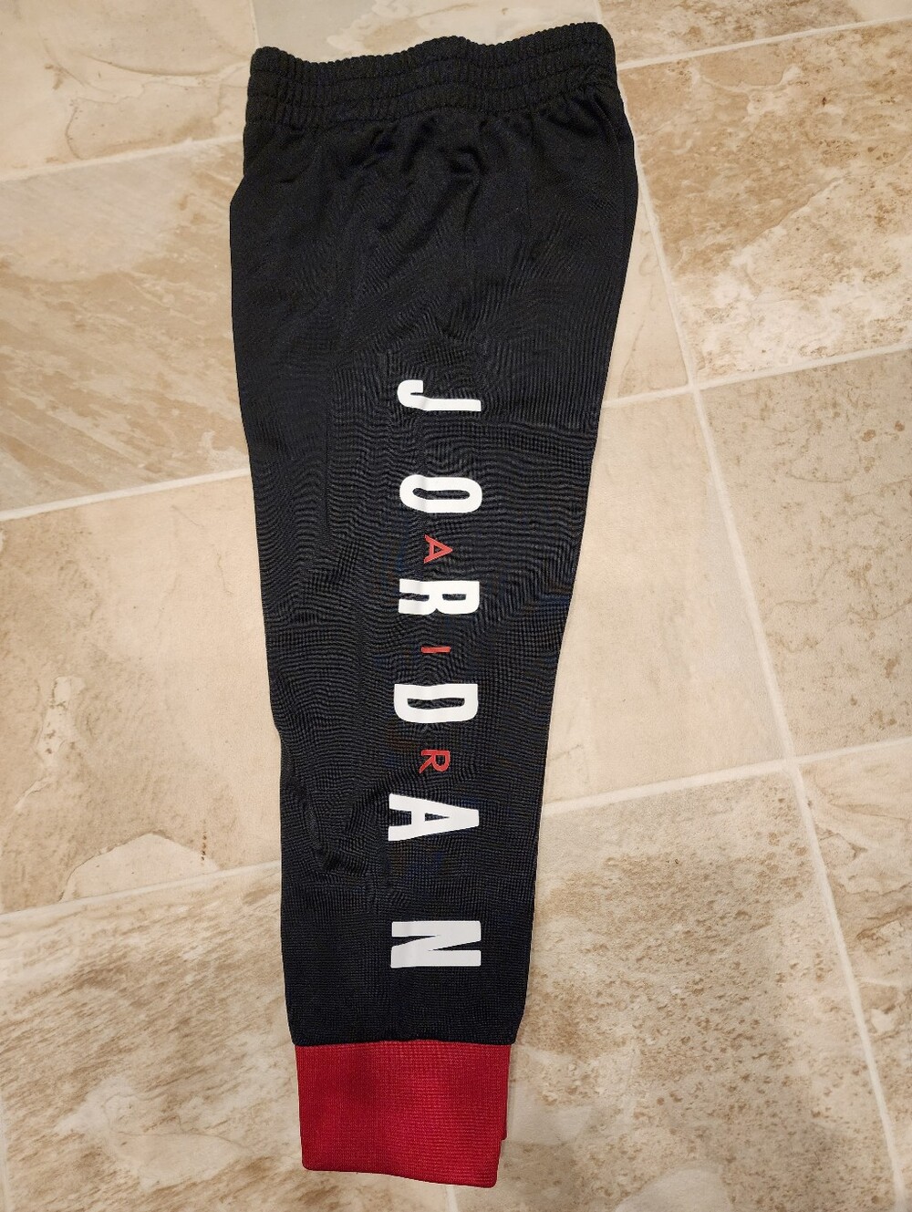 Jordan Black Joggers with White Vertical Logo and Red Cuff 3t